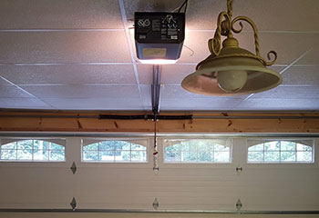 Interior view of newly installed insulated sectional garage door with windows in Darien, IL home